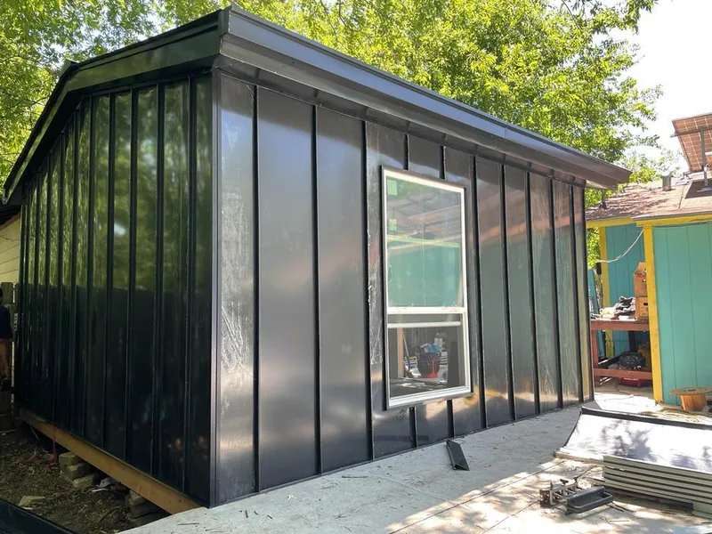 Black standing seam metal wall panels for Roof Inspection in Pearland