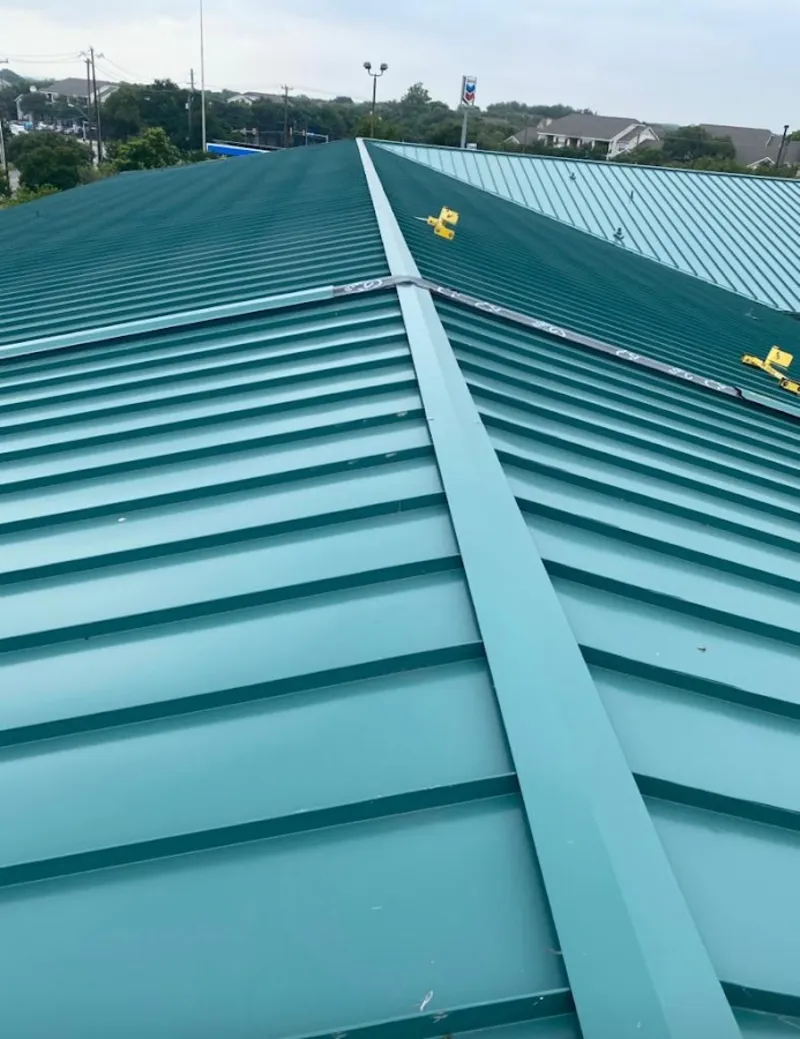 Green commercial metal roof ridge and valley for Metal Roof Repair in Pearland