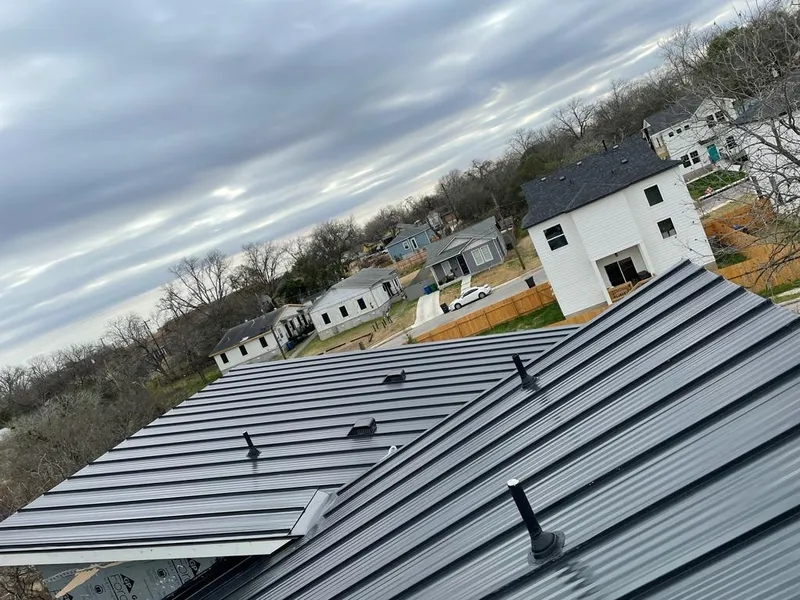 Standing seam metal roof panels with vents for Skylight Repair in Pearland